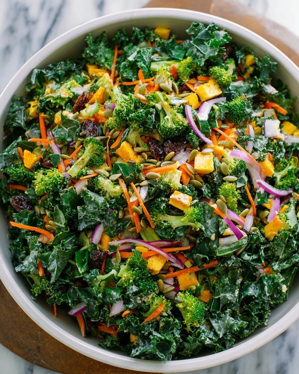 A close-up view of a colorful salad in a white bowl on a white marbled surface. The salad has several layers including fresh, bright green kale leaves that form the base, mixed with chunks of orange sweet potato cubes and light green chopped celery. There are also small purple bits of red onion and some crushed nuts scattered on top. A wooden spoon lifts some of the salad, showing the mixed textures of crisp vegetables and soft sweet potatoes. The lighting highlights the freshness and vibrant colors of all the ingredients, photo taken with an iphone --ar 4:5 --v 7