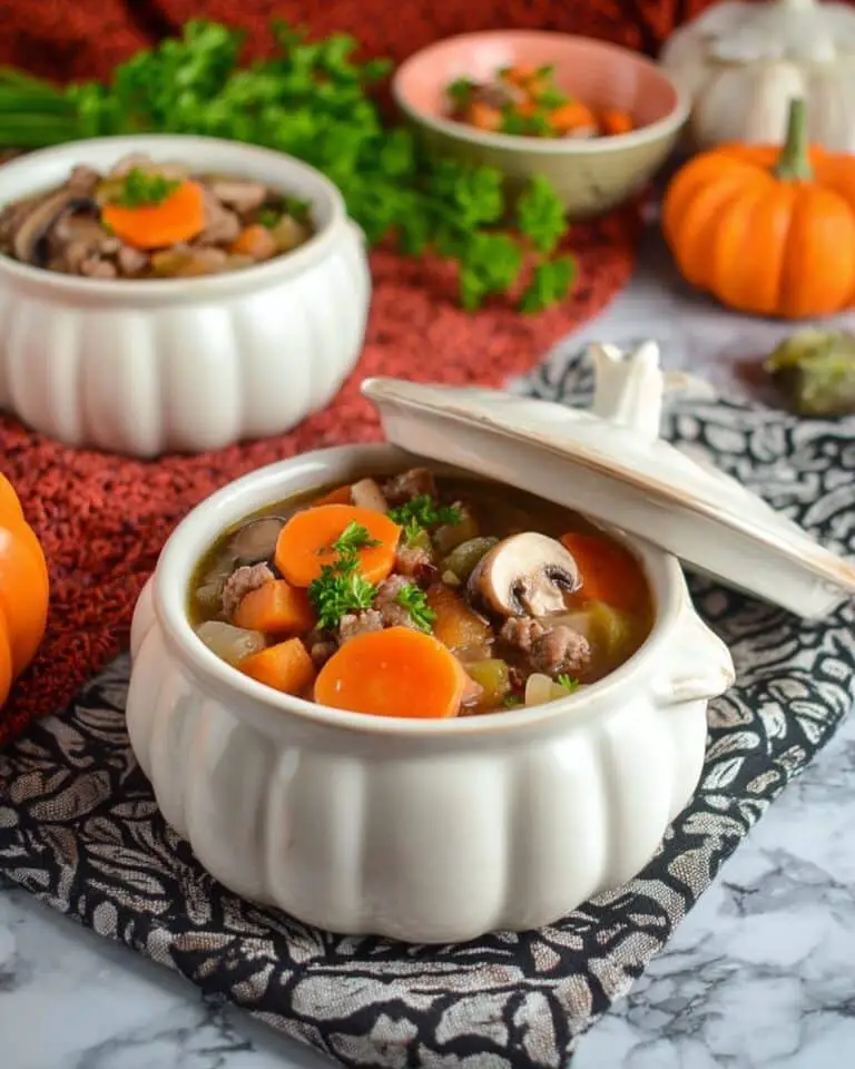 Slow Cooker Witches’ Brew Stew with Carved Pumpkin Carrots and Skull-Shaped Mushrooms Recipe