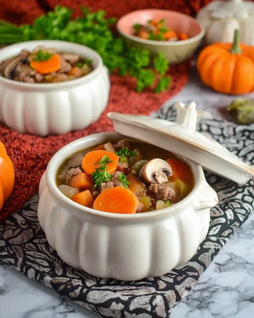 Slow Cooker Witches’ Brew Stew with Carved Pumpkin Carrots and Skull-Shaped Mushrooms Recipe