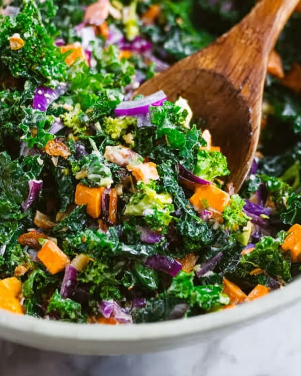 A large bowl filled with a mixed salad showing multiple layers of fresh chopped kale leaves in dark green, small light green broccoli florets scattered throughout, thin orange carrot strips, small cubes of orange cheddar cheese, and small pieces of purple-red onion. There are also small beige sunflower seeds sprinkled on top, all layered closely together creating a colorful and textured mix. The bowl is white and the whole scene is on a white marbled surface. The image is bright and clear with natural lighting, photo taken with an iphone --ar 4:5 --v 7