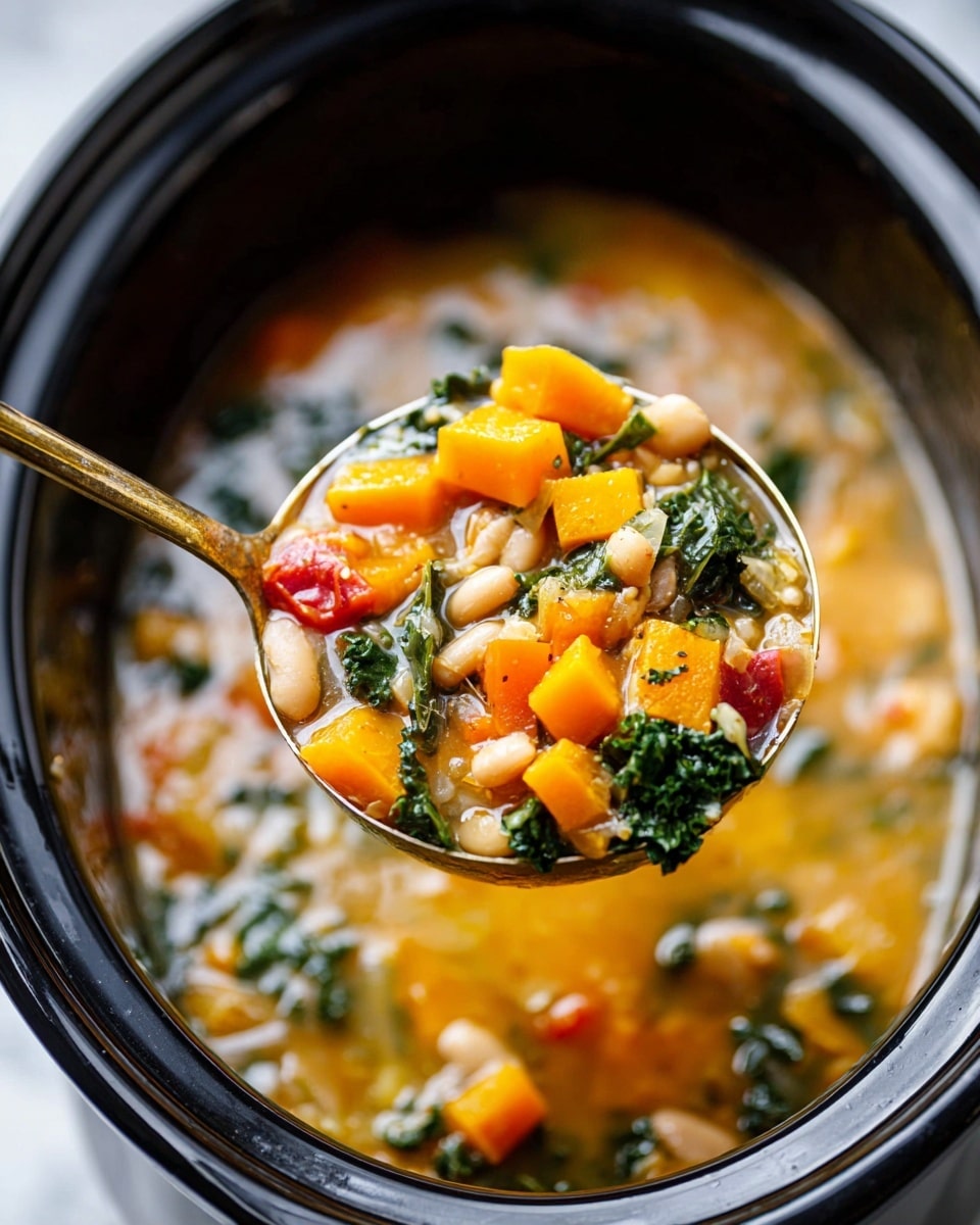 The image shows a close-up of a ladle scooping vegetable soup from a black slow cooker on a white marbled surface. The soup contains three layers of colors and textures: bright orange chunks of squash and smaller diced orange vegetables, creamy white beans that fill the middle, and dark green leafy kale mixed throughout. There is also a small piece of red vegetable visible near the top. The broth is clear and golden, with a slightly thick texture coating the ingredients. The ladle is made of metal and shines with a gold tint, held by a woman's hand just out of frame. Photo taken with an iphone --ar 4:5 --v 7
