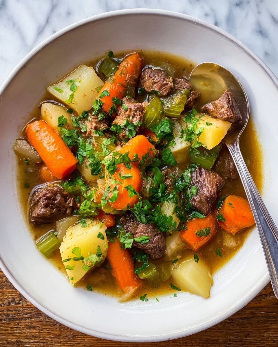 A white shallow bowl filled with beef stew sits on a white marbled surface. The stew has several layers: at the bottom is a light brown broth, above it are chunks of cooked beef with a dark brown and tender texture, bright orange carrot slices cut thick, pale green celery pieces, and light yellow potato cubes. The ingredients are mixed but mainly placed in the center, garnished with chopped green parsley on top. A shiny silver spoon rests on the edge of the bowl. photo taken with an iphone --ar 4:5 --v 7