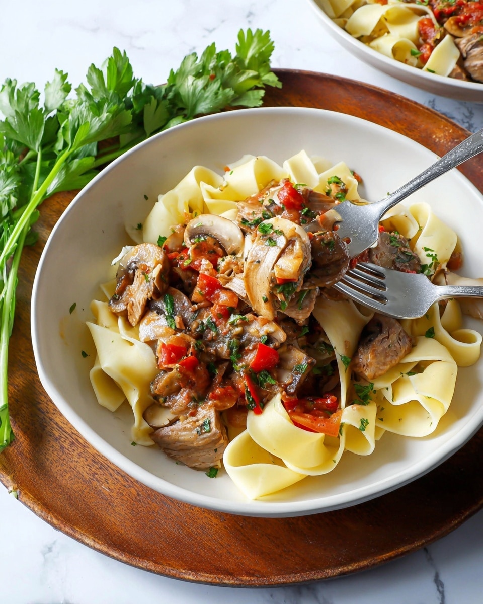Two white bowls with brown rims hold a dish of wide, flat yellow pasta noodles layered at the bottom. On top of the noodles are pieces of cooked chicken that are golden brown with a slight char. Around and on the chicken is a chunky vegetable sauce made of red tomatoes, orange carrots, white onions, and brown mushrooms, all mixed together. Fresh green parsley is sprinkled over the whole dish. The bottom bowl sits on a round wooden board with a bunch of fresh parsley to the side and a beige cloth nearby. The background is a white marbled texture. photo taken with an iphone --ar 4:5 --v 7