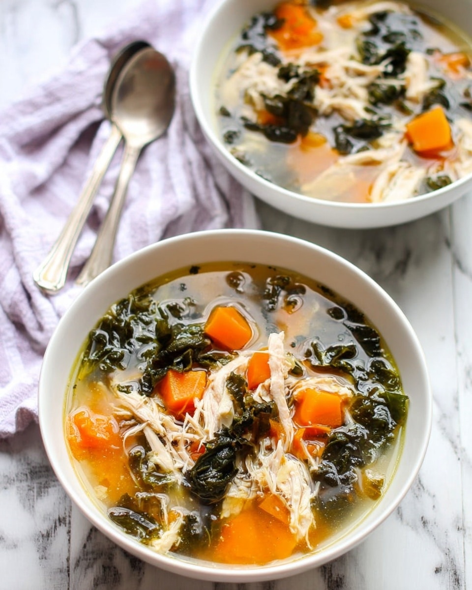 Two white bowls filled with clear broth soup sit on a white marbled surface, each containing shredded light-colored chicken, bright orange chunks of carrot, and dark green leafy vegetables. The soup layers consist of the clear broth base, evenly mixed with soft chicken pieces and chunky, vibrant orange carrot bits, accompanied by wilted dark green leaves floating throughout. Two silver spoons rest beside the front bowl, and a light purple striped cloth is partially visible in the background. Photo taken with an iphone --ar 4:5 --v 7