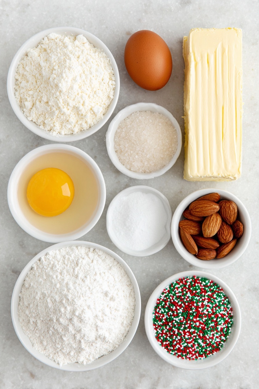 Flat lay of a stick of unsalted butter, a small heap of granulated sugar, one whole brown egg, a few almonds next to a small white bowl of clear almond extract, a small white bowl of pale vanilla extract, a mound of all-purpose flour, a small white bowl containing white cornstarch powder, a small white bowl filled with baking powder, a small white bowl of fine salt, a small white bowl filled with festive red and green nonpareil sprinkles, and three rectangles of cookie dough colored natural white, bright red, and vibrant green, all arranged in perfect symmetry on a clean white marble surface, soft natural light, photo taken with an iPhone, professional food photography style, fresh ingredients, white ceramic bowls, no bottles, no duplicates, no utensils, no packaging --ar 2:3 --v 7 --p m7354615311229779997 - Swirled Christmas Cookies, festive holiday cookies, colorful Christmas cookie recipe, easy holiday cookie ideas, buttery swirl cookies